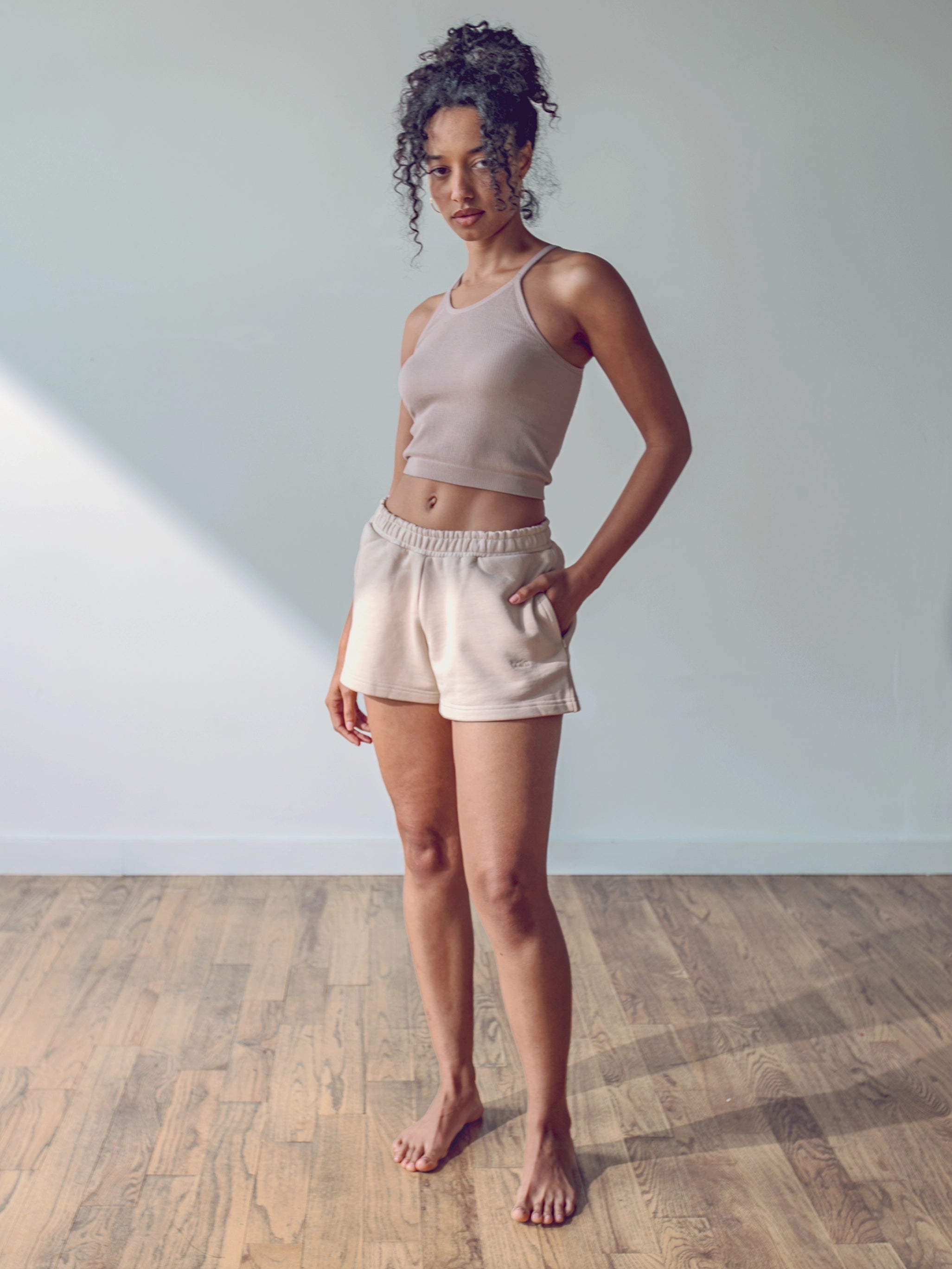 Close-up of a single green leaf against a white background.