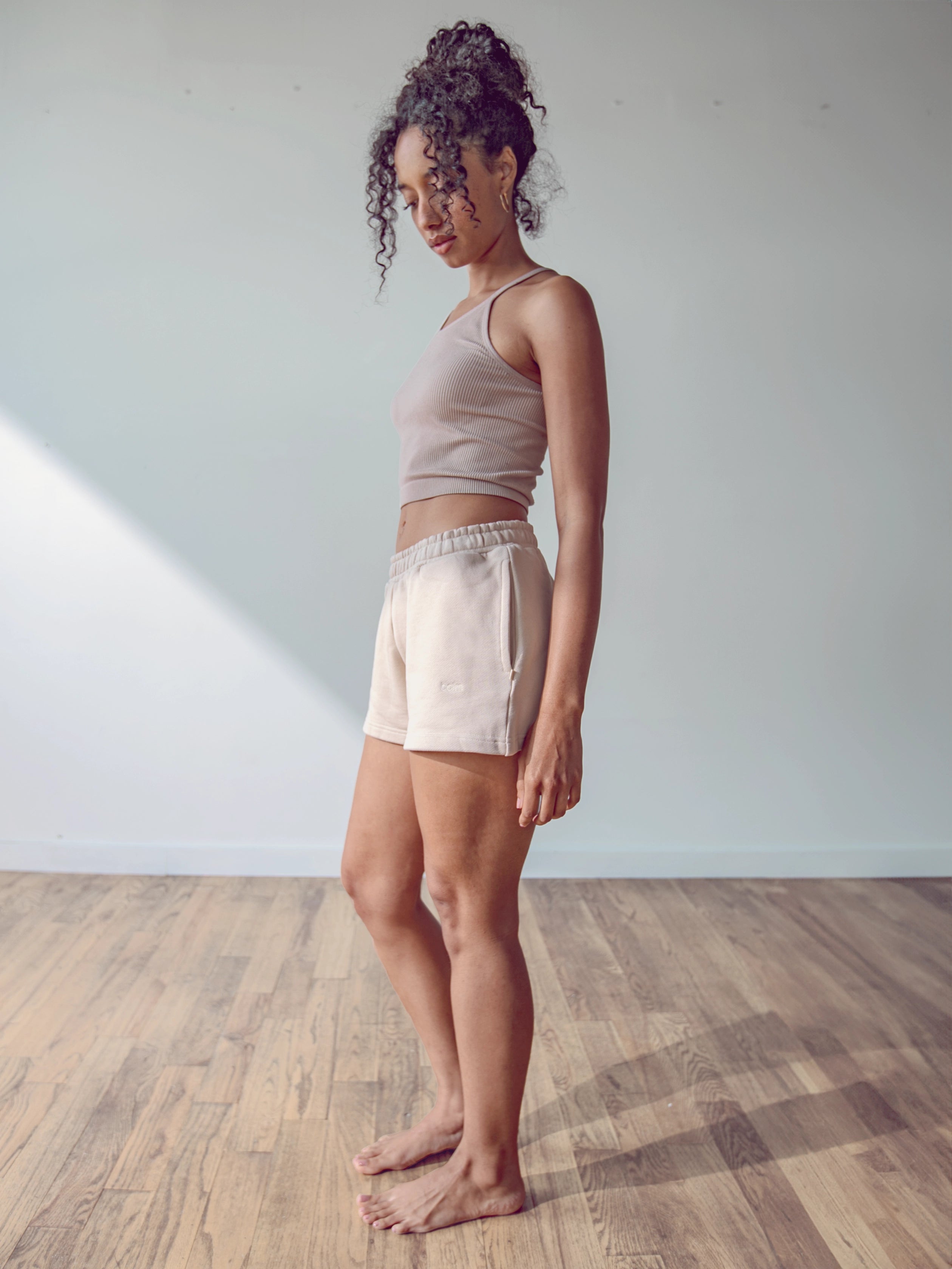 Close-up of a single green leaf against a white background.