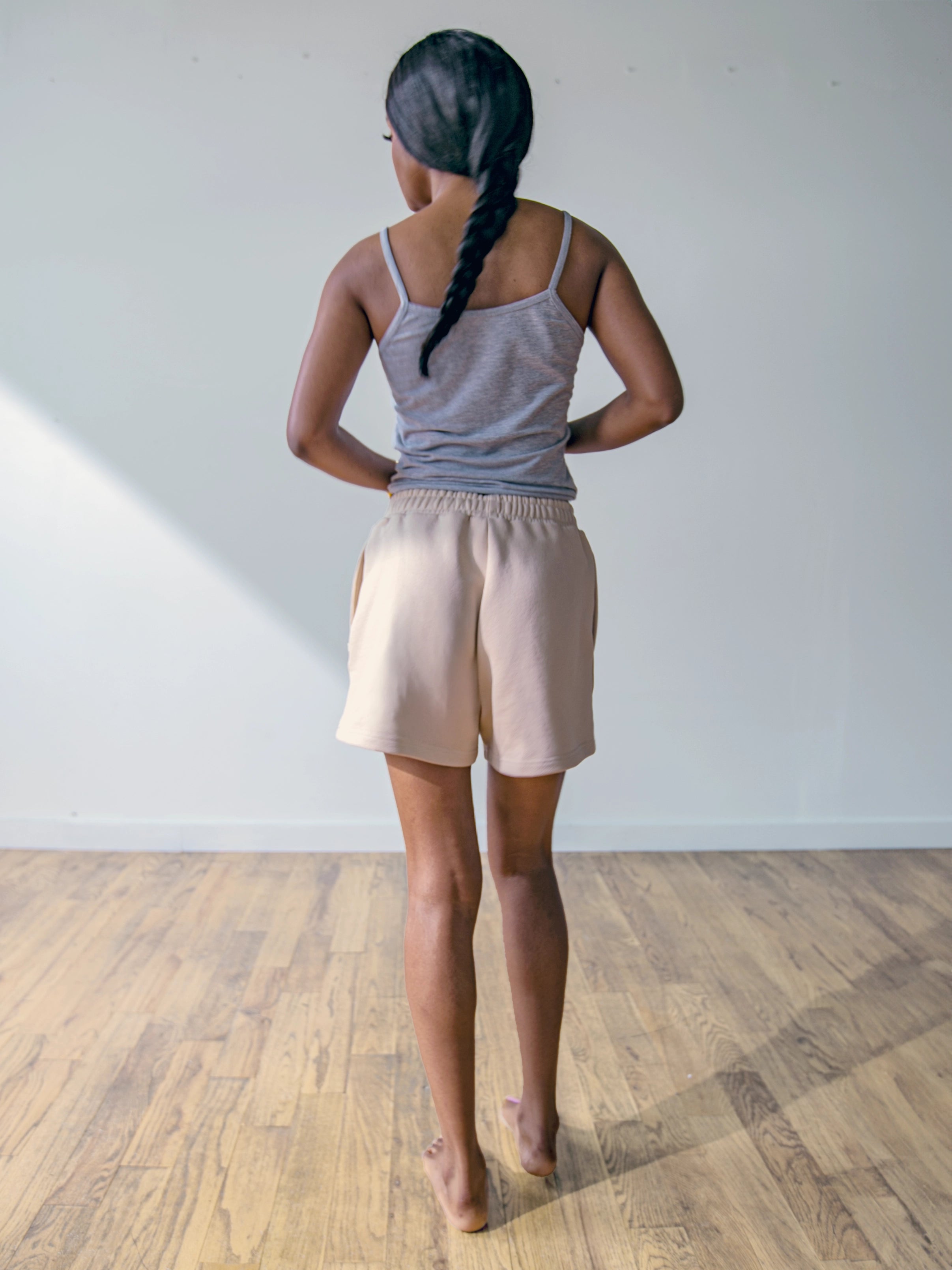 Close-up of a single green leaf against a white background.