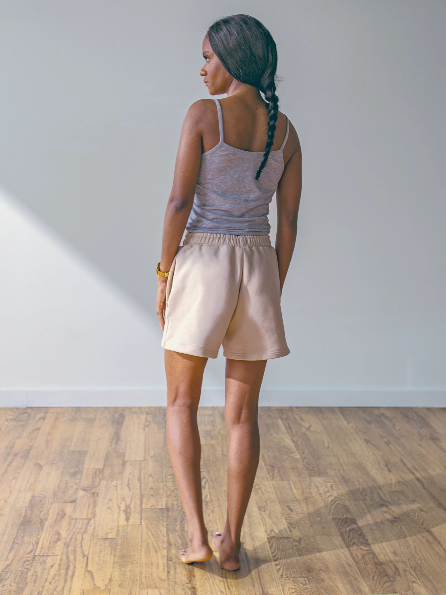 Close-up of a single green leaf against a white background.